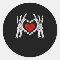 Skeleton Hands Form A Heart With Red Heart Bright