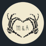 Skeleton Hands Heart Shape Custom Wedding Classic Round Sticker<br><div class="desc">Add a creepy, personalized touch to your wedding with these stickers. These round stickers are perfect for using as envelope seals when sending out wedding invitations or for decorating party favors. They are a cream or ivory color and feature an illustration of skeleton hands in a heart shape framing the...</div>
