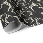 Skeleton Hands Heart Shape Goth Patterned Wrapping Paper<br><div class="desc">Add a creepy cool touch to your gifts with this wrapping paper. This goth patterned gift wrap features illustrations of skeleton hands in a heart shape. The graphics are in a cream or ivory color set against a black background.</div>