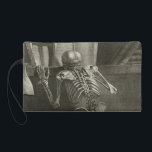 Skeleton reading wristlet<br><div class="desc">Reading Skeleton. Gamelin Nouveau recueil d’osteologie et de myologie (1779) The Nouveau recueil d’osteologie et de myologie (A New Collection of Bones and Muscles, Drawn from Life) contains witty and fantastical skeletons, engaged in many life-like pursuits, while maintaining a high level of accuracy and anatomical detail. Image from the collections...</div>