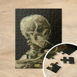 Skeleton with a Burning Cigarette | Van Gogh Jigsaw Puzzle<br><div class="desc">Skull of a Skeleton with Burning Cigarette (1886) by Dutch post-impressionist artist Vincent Van Gogh. Original painting is an oil on canvas, most likely from Van Gogh's short-lived period of drawing courses at the Academy of Art in Antwerp. The burning cigarette was probably intended as a joke, perhaps as a...</div>