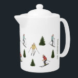 Ski Women With Family Name Christmas Watercolor Teapot<br><div class="desc">Destei's original hand-illustrated watercolor pattern featuring women skiing among green fir trees. Each skier wears a different color jacket including red, yellow and teal, bringing energy and life to the winter scene. This design captures the joy of outdoor winter activity and evokes a seasonal, festive feel. There is also a...</div>
