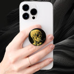 Skull with Burning Cigarette by Vincent van Gogh PopSocket<br><div class="desc">Skull with Burning Cigarette by Vincent van Gogh is a vintage fine art post impressionism still life painting. A portrait of human skeleton smoking. Great image to use for anti-smoking products. Smoking kills 1, 000s every year, help someone to quit smoking today. Great image for Halloween or Día de los...</div>