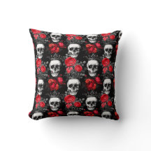Skulls crowns and faded red roses on a dark black