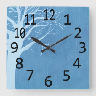 Sky blue tree silhouette on medium blue wall clock