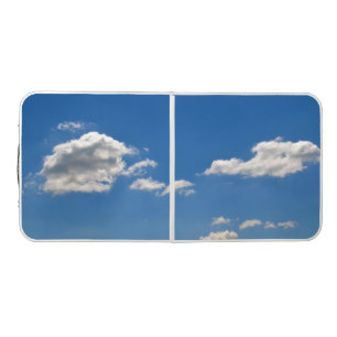 Sky is blue and white clouds are passing by beer pong table