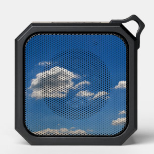 Sky is blue and white clouds are passing by bluetooth speaker