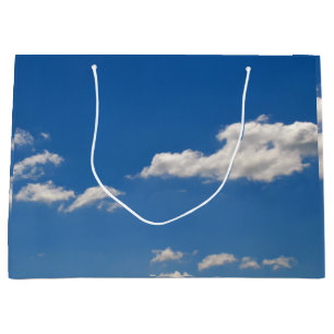 Sky is blue and white clouds are passing by  large gift bag