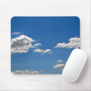 Sky is blue and white clouds are passing by mouse pad