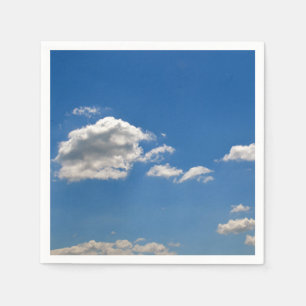 Sky is blue and white clouds are passing by napkins