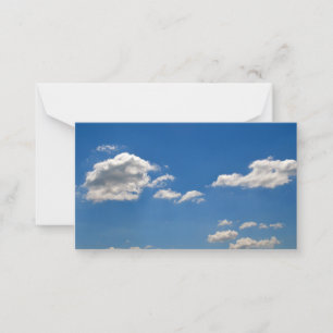 Sky is blue and white clouds are passing by   note card