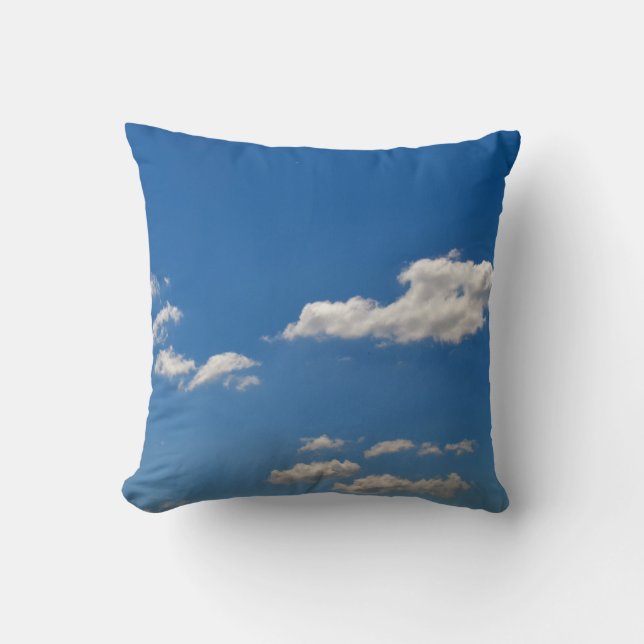 Sky is blue and white clouds are passing by  throw pillow (Front)