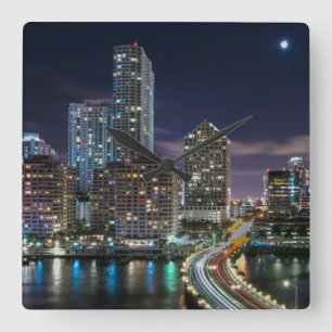 Skyline of Miami city with bridge at night Square Wall Clock