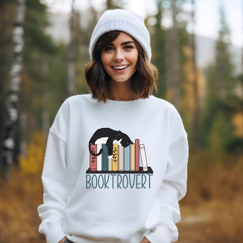 Sleeping black white cat on bookshelf booktrovert sweatshirt