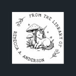 Sleeping Unicorn Toadstool Bookplate Stamp<br><div class="desc">Enchant your library with this personalized book stamp featuring a sleeping baby unicorn nestled beneath a magical toadstool. Surrounded by delicate ferns and fluttering butterflies,  this whimsical design adds a fairytale charm to every book. A dreamy gift for readers,  kids,  and lovers of fantasy and woodland magic.</div>