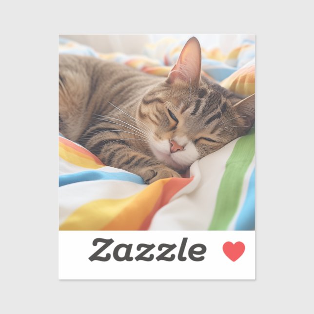 Sleepy tabby cat on colorful sheets sticker (Sheet)