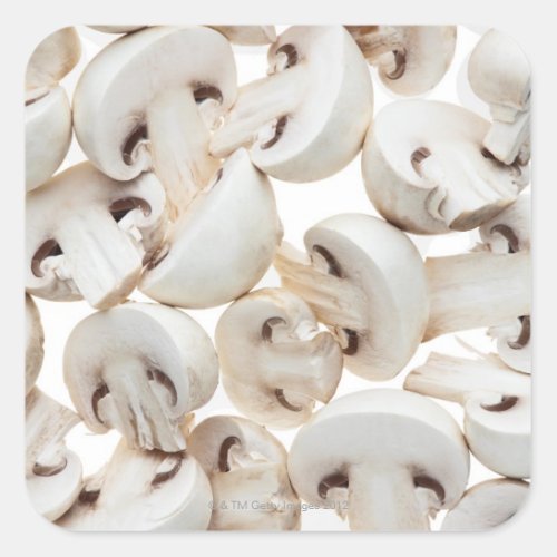 Sliced button mushrooms agaricus bisporus on square sticker