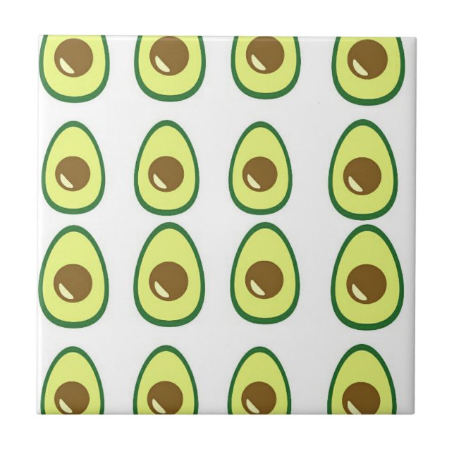 Sliced green avocado on white ceramic tile (Front)