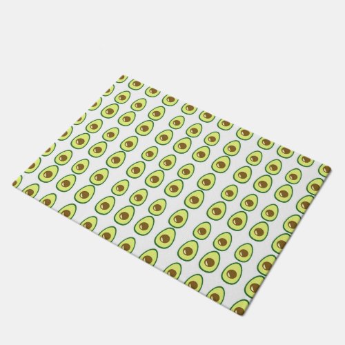 Sliced green avocado on white doormat