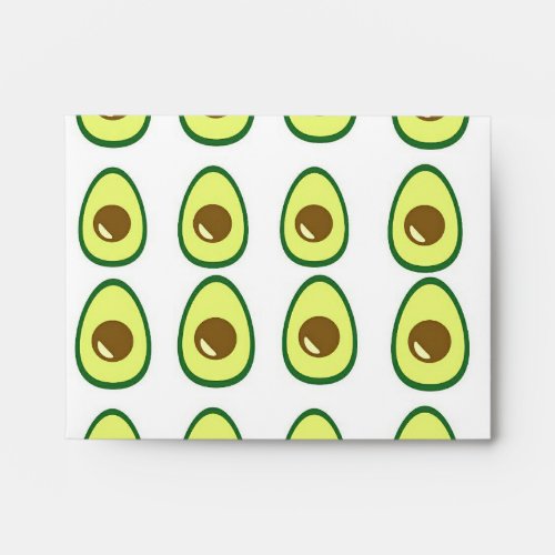 Sliced green avocado on white envelope