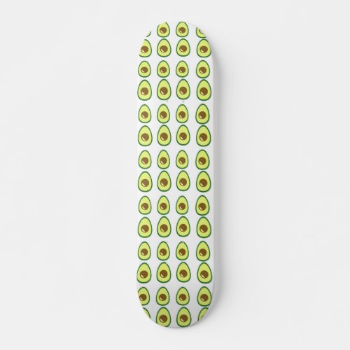 Sliced green avocado on white skateboard