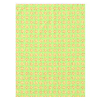 Sliced yellow pineapples on green table cloth