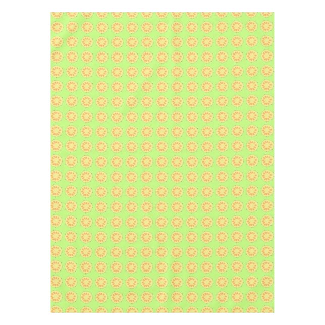 Sliced yellow pineapples on green table cloth (Front)