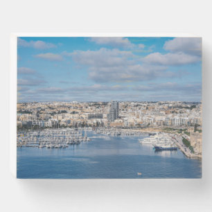 Sliema harbor with modern buildings and boats wooden box sign