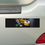 SlipperyJoe Hanukkah symbolic still life holiday e Bumper Sticker<br><div class="desc">SlipperyJoe Hanukkah symbolic still life holiday essence vibrant meaningful objects colorful slender pile menorah candles artistic red blue yellow and white sufganiyah doughnut classic jelly-filled commemorate miracle of the oil dreidels metallic gold glossy blue Hebrew great miracle happened there metallic pewter star of David medallion light resilience community themes spiritual...</div>