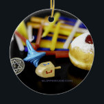 SlipperyJoe Hanukkah symbolic still life holiday e Ceramic Ornament<br><div class="desc">SlipperyJoe Hanukkah symbolic still life holiday essence vibrant meaningful objects colorful slender pile menorah candles artistic red blue yellow and white sufganiyah doughnut classic jelly-filled commemorate miracle of the oil dreidels metallic gold glossy blue Hebrew great miracle happened there metallic pewter star of David medallion light resilience community themes spiritual...</div>