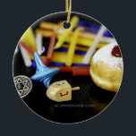 SlipperyJoe Hanukkah symbolic still life holiday e Ceramic Ornament<br><div class="desc">SlipperyJoe Hanukkah symbolic still life holiday essence vibrant meaningful objects colorful slender pile menorah candles artistic red blue yellow and white sufganiyah doughnut classic jelly-filled commemorate miracle of the oil dreidels metallic gold glossy blue Hebrew great miracle happened there metallic pewter star of David medallion light resilience community themes spiritual...</div>