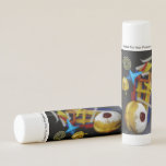 SlipperyJoe Hanukkah symbolic still life holiday e Lip Balm<br><div class="desc">SlipperyJoe Hanukkah symbolic still life holiday essence vibrant meaningful objects colorful slender pile menorah candles artistic red blue yellow and white sufganiyah doughnut classic jelly-filled commemorate miracle of the oil dreidels metallic gold glossy blue Hebrew great miracle happened there metallic pewter star of David medallion light resilience community themes spiritual...</div>
