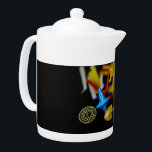 SlipperyJoe Hanukkah symbolic still life holiday e Teapot<br><div class="desc">SlipperyJoe Hanukkah symbolic still life holiday essence vibrant meaningful objects colorful slender pile menorah candles artistic red blue yellow and white sufganiyah doughnut classic jelly-filled commemorate miracle of the oil dreidels metallic gold glossy blue Hebrew great miracle happened there metallic pewter star of David medallion light resilience community themes spiritual...</div>