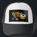 SlipperyJoe Hanukkah symbolic still life holiday e Trucker Hat<br><div class="desc">SlipperyJoe Hanukkah symbolic still life holiday essence vibrant meaningful objects colorful slender pile menorah candles artistic red blue yellow and white sufganiyah doughnut classic jelly-filled commemorate miracle of the oil dreidels metallic gold glossy blue Hebrew great miracle happened there metallic pewter star of David medallion light resilience community themes spiritual...</div>