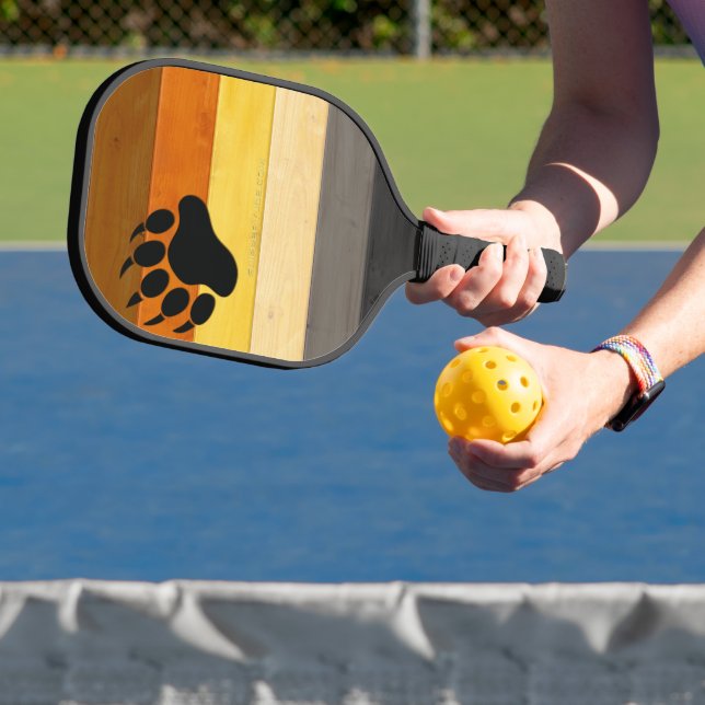 SlipperyJoe's Bear Pride flag wooden floor texture Pickleball Paddle (Insitu)