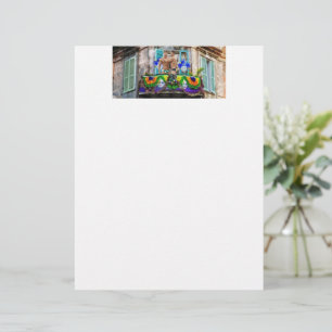 SlipperyJoe's festive Mardi Gras scene two men wea Letterhead