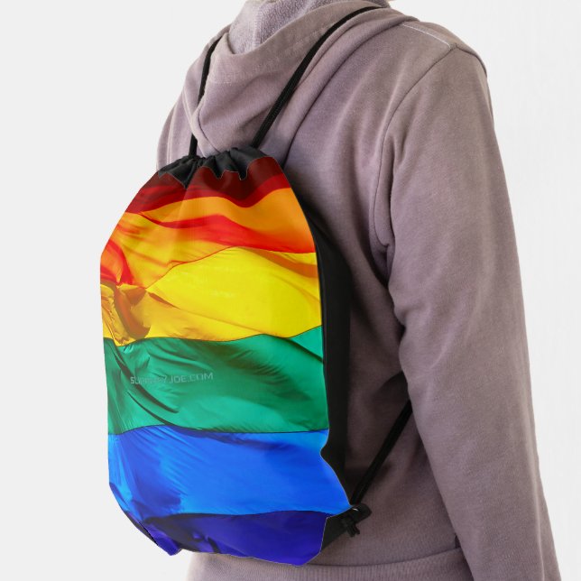 SlipperyJoe's gay pride flag waving red orange yel Drawstring Bag (Insitu)