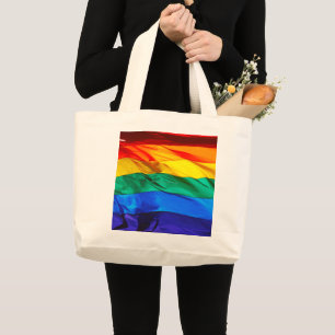 SlipperyJoe's gay pride flag waving red orange yel Large Tote Bag