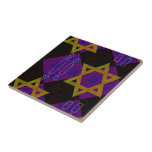 SlipperyJoe's Hanukkah-themed image golden yellow  Ceramic Tile<br><div class="desc">SlipperyJoe's Hanukkah-themed image golden yellow Star of David blue candles with orange flames Menorah-inspired art gift idea Jewish identity spirituality holiday retro bold symmetrical pattern diamond-shaped grid background blends tradition and vibrant design purple black checkerboard effect Hebrew religious celebration</div>