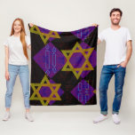 SlipperyJoe's Hanukkah-themed image golden yellow  Fleece Blanket<br><div class="desc">SlipperyJoe's Hanukkah-themed image golden yellow Star of David blue candles with orange flames Menorah-inspired art gift idea Jewish identity spirituality holiday retro bold symmetrical pattern diamond-shaped grid background blends tradition and vibrant design purple black checkerboard effect Hebrew religious celebration</div>