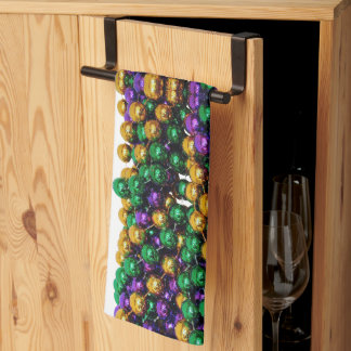 SlipperyJoe's iconic Mardi Gras–themed image elega Kitchen Towel