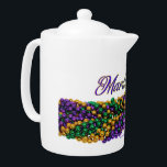SlipperyJoe's iconic Mardi Gras–themed image elega Teapot<br><div class="desc">SlipperyJoe's iconic Mardi Gras–themed image elegant flowing script yellow outline shiny metallic bead necklaces gifts new orleans traditional purple gold green artistic symmetrical decorative pattern glossy reflective celebratory parade ready emphasizing abundance sparkles festival colors Carnival Fat Tuesday festival lively vibrant spirited party extravagant cultural masked energy</div>