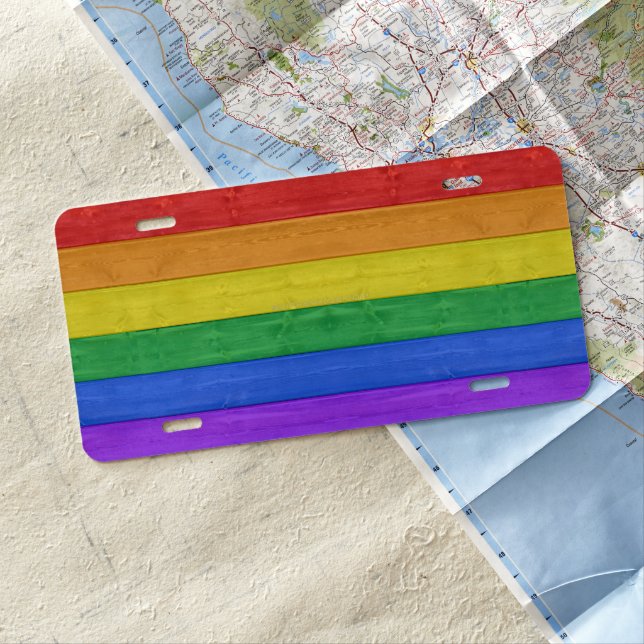 SlipperyJoe's pride wooden flag horizontal rainbow License Plate (In Situ)