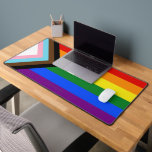 SlipperyJoe's Progress Pride Flag six classic hori Desk Mat<br><div class="desc">SlipperyJoe's Progress Pride Flag six classic horizontal rainbow stripes forward pointing chevron white pink light blue transgender brown black for marginalized communities those lost impacted HIV AIDS artistic LGBTQIA gay pride gifts proud inclusive and intentionally modern clean bold high contrast style shape creates sense motion momentum red orange yellow green...</div>
