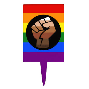SlipperyJoe's queer people color flag raised fist Cake Topper