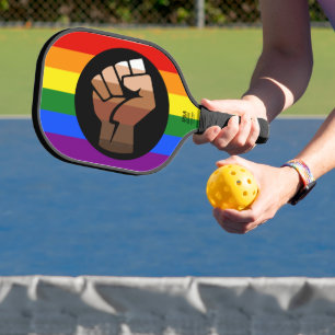 SlipperyJoe's queer people color flag raised fist  Pickleball Paddle