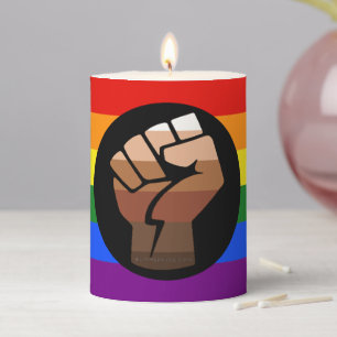 SlipperyJoe's queer people color flag raised fist Pillar Candle