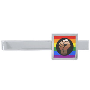 SlipperyJoe's queer people color flag raised fist Silver Finish Tie Bar