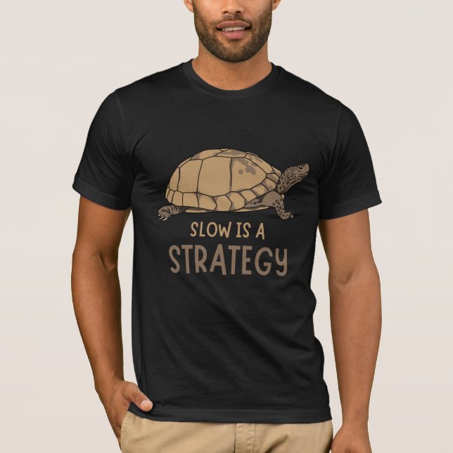 Slow Is a Strategy – Minimal Turtle Quote Design T-Shirt (Front)