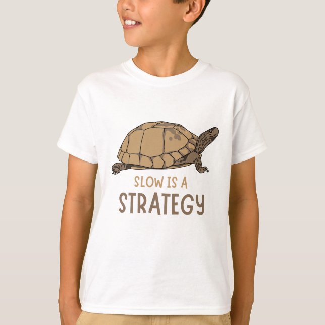 Slow Is a Strategy – Minimal Turtle Quote Design T-Shirt (Front)